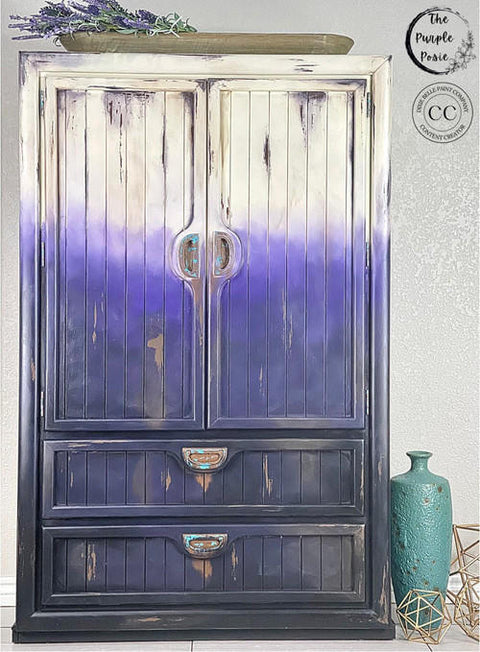 Dixie Belle Paint Amethyst Chalk Mineral Paint is the perfect paint for any DIY project! Painted cabinet fading from white to purple using our Amethyst Chalk Mineral Paint.