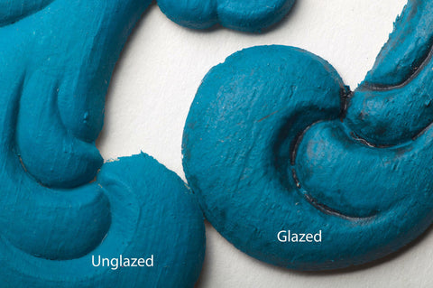 Dixie Belle Paint Black Glaze.
This shows two appliques painted blue.  One is unglazed and one is glazed in the Black Glaze.  The pieces have Unglazed and Glazed over the appropriate applique.