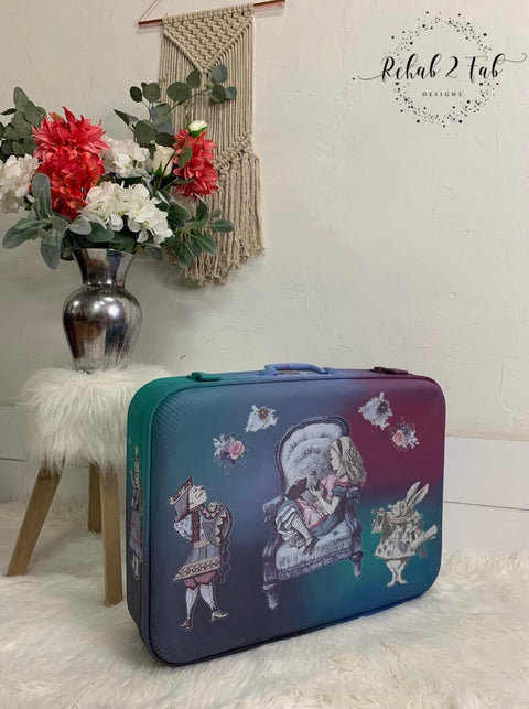 Dixie Belle Paint Blueberry Chalk Mineral Paint is the perfect paint for any DIY project!
Suitcase painted with a mixture of Blueberry Chalk Mineral Paint and other colors blended together. Decorated with the Belles & Whistles Transfer in Alice.