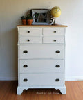 Dixie Belle Paint Buttercream Chalk Mineral Paint is the perfect paint for any DIY project!
Chest of drawers painted in Buttercream Chalk Mineral Paint with bronze hardware and a natural wood top. Staged with a globe, two terracotta pots with plants and a white picture frame.
