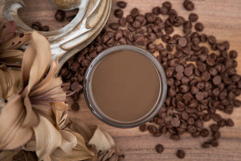 Dixie Belle Paint Chocolate Chalk Mineral Paint is the perfect paint for any DIY project!
Opened container of Chocolate Chalk Mineral Paint. Staged with chocolate chips and tan flowers.