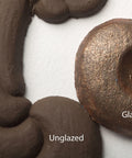 Dixie Belle Paint Copper Bronze Glaze 
This shows two appliques painted brown.  One is unglazed and one is glazed in the Copper Bronze Glaze.  The pieces have Unglazed and Glazed over the appropriate applique.