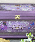 Dixie Belle Paint Dixie Dirt-4oz. 
Purple jewelry using Dixie dirt as an accent on the panels. Jewelry box has Enchanted Garden - Stencil and Wildflowers & Butterflies - Transfer on the inside of panels . Staged with white flowers around box.