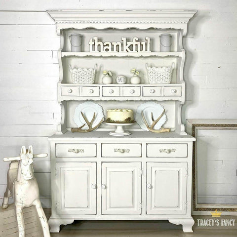 Dixie Belle Paint Fluff Chalk Mineral Paint is the perfect paint for any DIY project! Shabby Chic Kitchen China Cabinet chalk painted with Fluff chalk paint. Fluff is a serene, soft white with a slight gray undertone. Use Fluff for traditional or modern style projects.

You can also pair this paint color with a dark wax or glaze to create distressed farmhouse furniture. Fluff is a crisp color, perfect for any room in your home!