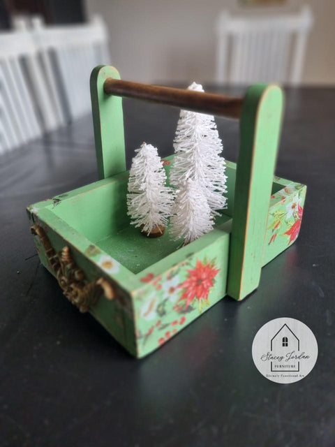 Dixie Belle Paint Kudzu Chalk Mineral Paint is the perfect paint for any DIY project!
Miniature tray with handle painted in Kudzu Chalk Mineral Paint with white and red flowers pattern on the piece. Staged inside the tray is 3 white miniature christmas tree.