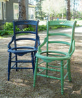 Dixie Belle Paint Kudzu Chalk Mineral Paint is the perfect paint for any DIY project!
Two vintage chairs one painting in Kudzu Chalk Mineral Paint and the other painted in Bunker Hill Blue CMP staged outside on a dirt driveway.