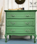 Dixie Belle Paint Kudzu Chalk Mineral Paint is the perfect paint for any DIY project!
Dresser painted in Kudzu Chalk Mineral Paint with matching hardware. Staged with books on top of the piece.