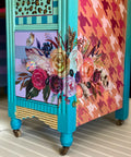 Dixie Belle Paint Lucky Lavender Chalk Mineral Paint is the perfect paint for any DIY project!
Bedside table with blue framing and side panel orange with Houndstooth - Stencil, and bottom drawer with Lucky Lavender Chalk Mineral Paint striped with a mute blue. with Flower Child Transfer on both the front and side.