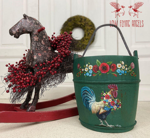 Dixie Belle Paint Palmetto Chalk Mineral Paint is the perfect paint for any DIY project! Green chalk painted wood pale, with chicken and flower rub on transfers. Staged next to  a toy rocking horse.