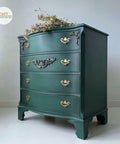 Dixie Belle Paint Palmetto Chalk Mineral Paint is the perfect paint for any DIY project! Green chalk painted bedside table with gold hardware. Staged with floral arrangement.