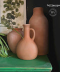 Dixie Belle Paint Pine Cone Chalk Mineral Paint is the perfect paint for any DIY project! Light brown Chalk mineral painted vases made to look like clay vases.