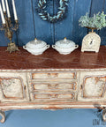 Dixie Belle Paint Pine Cone Chalk Mineral Paint is the perfect paint for any DIY project! Light brown Chalk mineral painted dresser distressed to make look chippie. Staged with candle stick holder and ceramic pots and vintage scale.