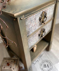 Dixie Belle Paint Pine Cone Chalk Mineral Paint is the perfect paint for any DIY project! Light brown Chalk mineral paint end table close up with a gold painted stencil design up top and decoupage paper on the drawer.