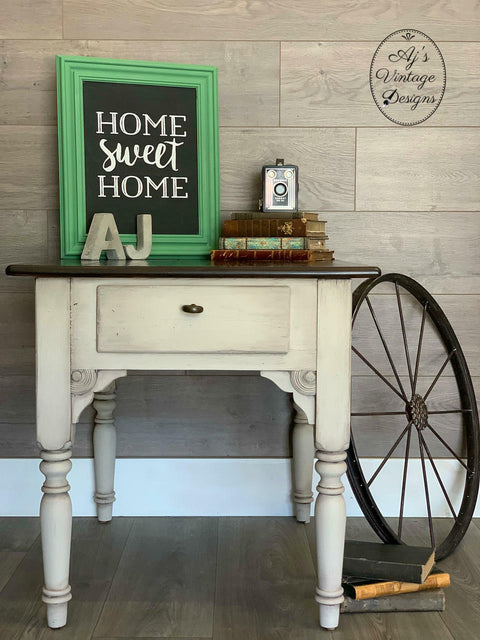 Dixie Belle Paint Sand Bar Chalk Mineral Paint is the perfect paint for any DIY project! An end table that is painted in sand bar and staged with various home decor items.