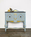 Dixie Belle Paint Savannah Mist Chalk Mineral Paint is the perfect paint for any DIY project! This end table is painted in the light blue color, savannah mist, with golden accents.