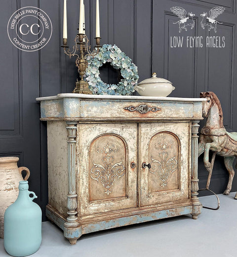 Dixie Belle Paint Savannah Mist Chalk Mineral Paint is the perfect paint for any DIY project! A french cabinet with the trim is painted in savannah mist blended into a cream color on the base of the cabinet.