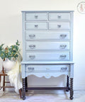 Dixie Belle Paint Savannah Mist Chalk Mineral Paint is the perfect paint for any DIY project! A tall dresser that is painted in savannah mist and has numerous drawers.