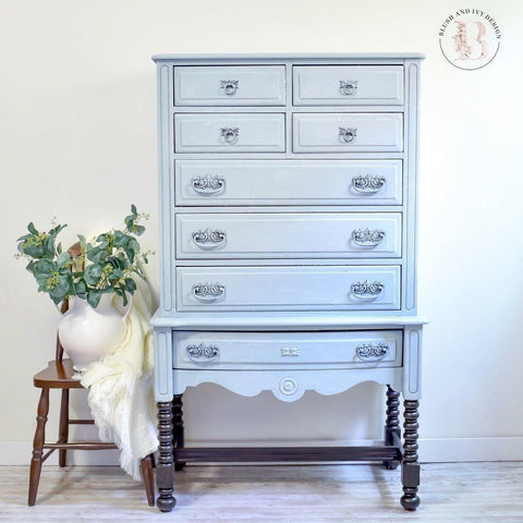 Dixie Belle Paint Savannah Mist Chalk Mineral Paint is the perfect paint for any DIY project! A tall dresser that is painted in savannah mist and has numerous drawers.