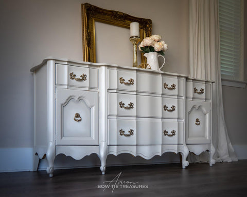 Dixie Belle Paint Sawmill Gravy Chalk Mineral Paint is the perfect paint for any DIY project! This antique dresser is painted in sawmill gravy with gold hardware.