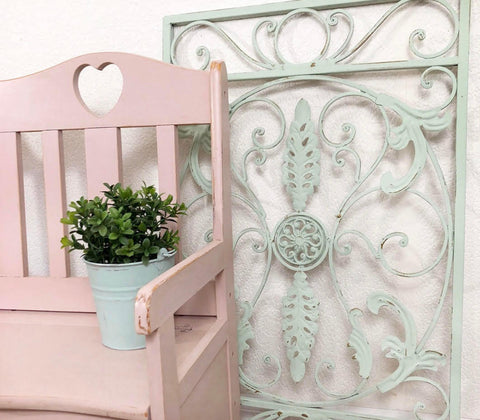 Dixie Belle Paint Soft Pink Chalk Mineral Paint is the perfect paint for any DIY project! A wooden chair with a heart of the top middle of the back and the chair is painted in soft pink chalk mineral paint with a distressed look on the edges.
