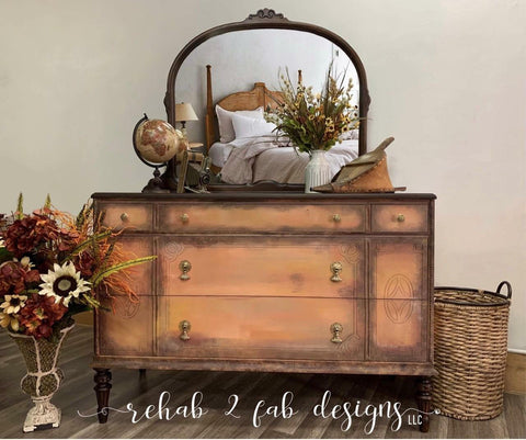 Dixie Belle Paint Terracotta Chalk Mineral Paint is the perfect paint for any DIY project!  A brown chalk painted dresser with dark edges and a mirror on the top.