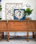 Dixie Belle Paint Terracotta Chalk Mineral Paint is the perfect paint for any DIY project!  A brown chalk painted buffet with dark antiqued edges and gold pull knobs.