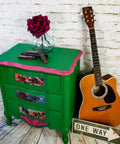 Dixie Belle Paint Tree Frog Green Chalk Mineral Paint is the perfect paint for any DIY project! A green chalk painted nightstand with pink chalk painted trim and floral decoupage applied to the front of the drawers.