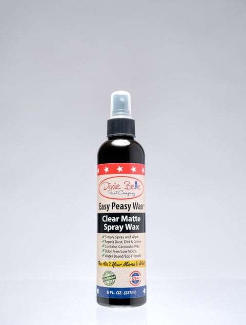 A bottle of Dixie Belle Paint Company Easy Peasy Wax Clear Matte Spray Wax is standing upright against a plain white background. The label highlights its features and the bottle contains 8 fl oz (237 ml).