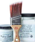 Kitchen Starter Bundle is perfect for a DIY kitchen makeover! close up image that has the Mini angle Brush in the center on the left has an 8oz container of Pristine Clean from the Silk All-in-one Paint with a 32oz Silk All-in-One Mineral Paint in Salt Water on the right, on a white background.