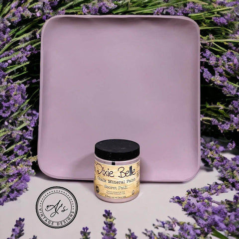 Wooden tray painted with Secret Path Chalk Mineral Paint. Staged with lavender surrounding the wooden tray and paint jar.