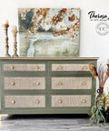 Cactus Silk All-In-One paint is perfect for painting kitchen cabinets, bathroom cabinets and painting furniture. 
A rattan dresser with the body painted in Cactus Silk All-In-One paint and left with natural wood top. A Painting of water landscape hangs above the piece with two candle pedestal on top of the dresser.