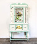 Endless Shore Silk All-In-One paint is perfect for painting kitchen cabinets, bathroom cabinets and painting furniture. White and teal painted armoire. Sunflowers rub on furniture Transfer applied on the front of the drawer and inside the armoire.