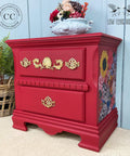 Fiery Sky Silk All-In-One paint is perfect for painting kitchen cabinets, bathroom cabinets and painting furniture.
Bedside table painted in Fiery Sky Silk All-In-One paint with gold hardware and Whimsical Wonderland - Transfer on the side panel of the piece. Staged with a white center bowl with flowers inside.