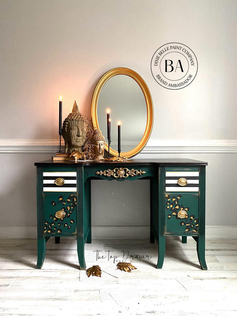 Midnight Green Silk All-In-One paint is perfect for painting kitchen cabinets, bathroom cabinets and painting furniture. Dark green Silk all in one painted desk with cheetah print and black and white stripes on the drawers. Staged with a gold mirror, some candle sticks and buddha heads.