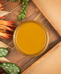 Mojave Silk All-In-One paint is perfect for painting kitchen cabinets, bathroom cabinets and painting furniture. Top View of Mojave  yellow Silk paint Staged with  a cactus and some desert plants.