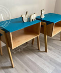 Oasis Silk All-In-One paint is perfect for painting kitchen cabinets, bathroom cabinets and painting furniture. Two end tables with the tops chalk painted blue. and the bottoms stained natural wood color. Staged with woodland figures.