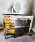 A vintage vanity table with Sunny Daze A1 Rice Decoupage Paper design on its drawers, set against a neutral wall and floor, adding a creative touch to the room.