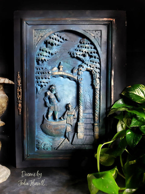 Blue Moon Terra Clay Paint provides endless possibilities for your imagination and can be used on wood, canvas, tile, fabric and more!
A 3D  black picture frame with Blue Moon Terra Clay Paint to accent the inside of art with gold accents on the high points.Staged with a black background and greenery.