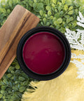 Bougainvillea Terra Clay Paint provides endless possibilities for your imagination and can be used on wood, canvas, tile, fabric and more!
Opened container of Bougainvillea Terra Clay Paint staged with white pine branches, Greenery, slim wooden tray with a yellow linen.
