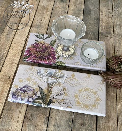 Moon Beam Terra Clay Paint provides endless possibilities for your imagination and can be used on wood, canvas, tile, fabric and more! Cream Terra Clay painted tiles with rub on transfers and stencils painted on. Staged with tea light candles.