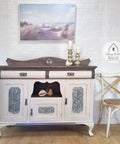 Moon Beam Terra Clay Paint provides endless possibilities for your imagination and can be used on wood, canvas, tile, fabric and more! Vintage cabinet painted with Terra Moon Beam and patina rusted doors. Staged next to  a rusted chair with some candle sticks.