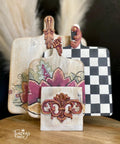 Moon Beam Terra Clay Paint provides endless possibilities for your imagination and can be used on wood, canvas, tile, fabric and more! Cutting boards painted with Cream terra paint with various floral designs and a checkerboard.