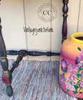 Moon Beam Terra Clay Paint provides endless possibilities for your imagination and can be used on wood, canvas, tile, fabric and more! Multicolor painted chair legs with Terra Moon Beam and other colors. Staged next to a yellow and pink Ombre vase with purple painted flowers.