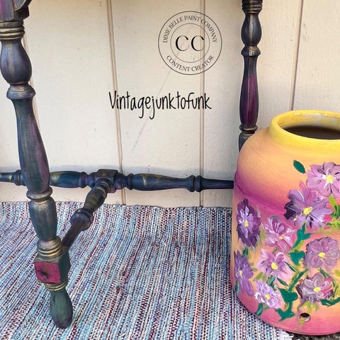Moon Beam Terra Clay Paint provides endless possibilities for your imagination and can be used on wood, canvas, tile, fabric and more! Multicolor painted chair legs with Terra Moon Beam and other colors. Staged next to a yellow and pink Ombre vase with purple painted flowers.