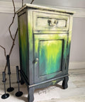 Pistachio Terra Clay Paint provides endless possibilities for your imagination and can be used on wood, canvas, tile, fabric and more! Yellow, green and black clay painted end table blended together. Staged with a wood stick and black candle sticks.