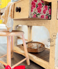 Light natural wood piece with the Vintage Wallpaper decoupage paper applied on the side of the drawer.