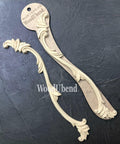 WoodUBend Applique #1245.26 (set of 2) is the perfect mouldable embellishment for any project! Applique #1245.26 beside and on packaging against black background. Shows 2 molds.
