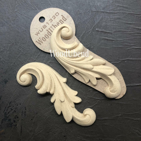 WoodUBend Applique #1320 (set of 2) is the perfect mouldable embellishment for any project! Applique #1320 (set of 2)with packaging against black background.