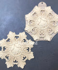 WoodUBend Applique #1323.26 (Set of 2) is the perfect mouldable embellishment for any project! Applique #1323.26 (Set of 2) with packaging against black background.