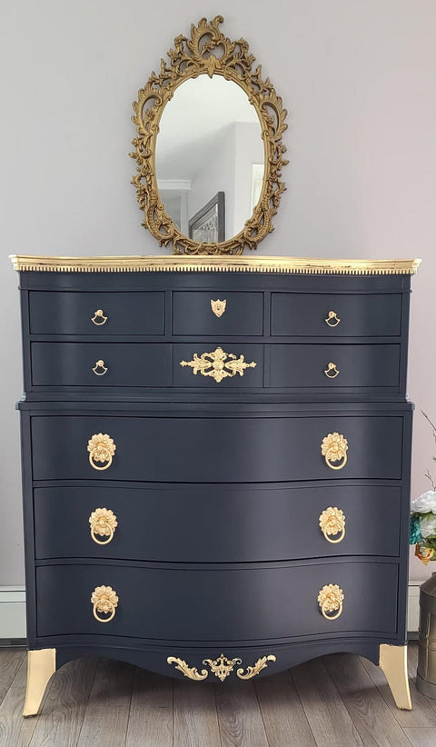 WoodUBend Applique #1339 (Set of 2) is the perfect mouldable embellishment for any project! Image of one Applique #1339 applied to dark blue  chalk mineral painted dresser. The applique, hardware and accents are finished in gold.